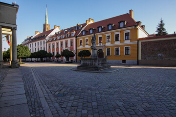 Fototapeta na wymiar Ostrow Tumski in Wroclaw - the oldest part of the city with colourful, old tenement houses, lanterns, bridges and churches. Lovely place for walk.