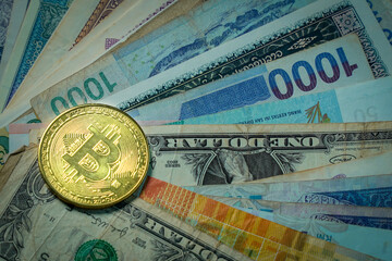 Bitcoin cryptocurrency on banknote background.