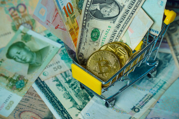 Bitcoin cryptocurrency on banknote background.