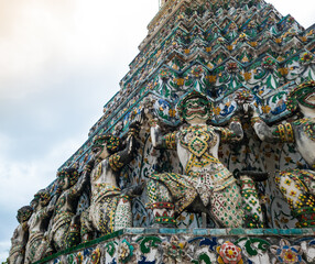 Architecture statues detail of Phra Prang at Wat Arun or Temple of Dawn.