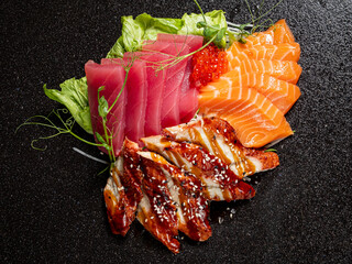 tasty sashimi on the black background