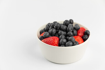 Strawberries and blueberries in a bowl