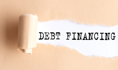 The text DEBT FINANCING appears on torn paper on white background.