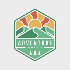Logo for outdoor adventure travel badge with mountain landscape.