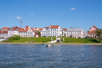 Minsk, Belarus - JUNE 24, 2022 : Vacationers on the Svisloch river in the center of Minsk . Traetskae Pradmestse or Trinity Suburb e historical center of Minsk.