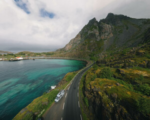 Van standing by a lake and a mountain