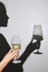 Woman shadow and  White Wine Glass