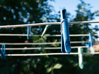 a clothespin hanging on a wooden string