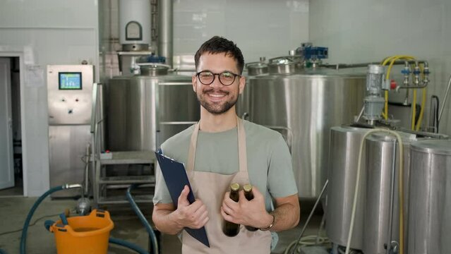 Portrait of male brewer in craft brewery.