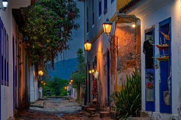 Bucolic street in the city of Paraty in the state of Rio de Janeiro with its colonial-style houses and cobblestones at dusk.