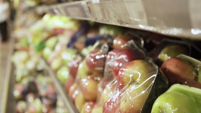 Apples in plastic wrap.