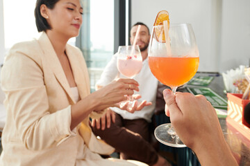 Group of friends having small celebration at fancy restaurant