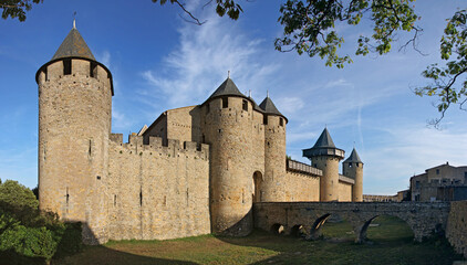Medieval castle of the earls of Trencavel with towers and a bridge across its dry moat in the old town of Carcassonne in France