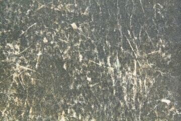 Abstract pattern of old aged grey coverbook canvas texture background. Front cover of stained ancient vintage book. Empty damaged shabby scratched wrinkled paper cardboard. Flatlay, mock up, close-up