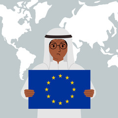 A arabic man holds the flag of the European Union in his hands against the background of a world map.
