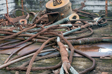A large pile of rusted lying steel cables.