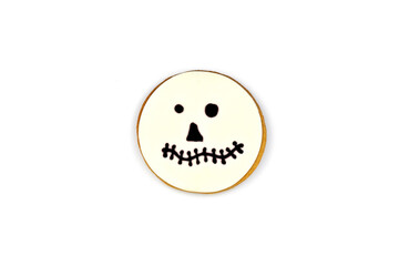 Jack Skellingtons spooky funny handmade cookie face with big eyeballs on white background....