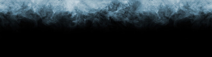 Abstract smoke texture frame over black background. Fog in the darkness. Natural pattern.