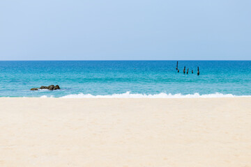 Fototapeta na wymiar Tropical beach in south of Thailand, white sandy beach with blue sea, summer season background