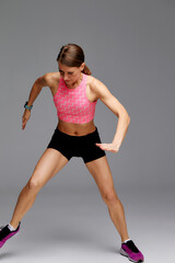 Fototapeta na wymiar Fitness woman jumping and running, working out. Athletic girl doing jump