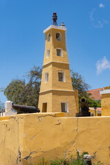 Fototapeta premium Kralendijk, Bonaire, Caribbean Netherlands: Fort Orange (Dutch: Fort Oranje) military fortification. Lighthouse and cannons scavenged from British ship.