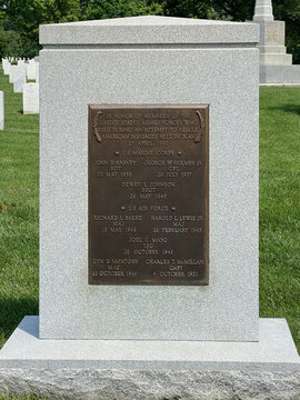 Washington DC: Arlington National Cemetery. The Iran Rescue Mission Memorial commemorates U.S. service members role in Iranian Revolution hostage crisis. Marble stone with bronze plaque.