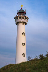 View of the lighthouse of Egmond aan Zee/Netherlands in the warm evening light