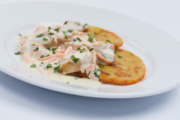 potato pancakes with sauce on white