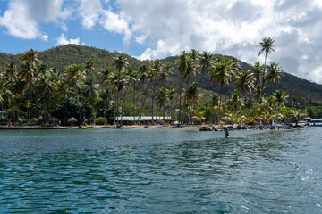 Marigot Bay, Saint Lucia. Idyllic bay and hurricane hole on the western coast of the Caribbean island country of St Lucia. Surrounded on three sides by steep, forested hills.