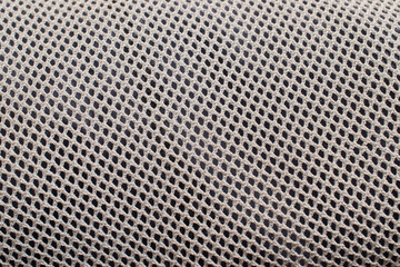The texture of a fine white grid on a dark background, horizontal format
