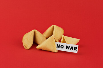 Chinese fortune cookies on red background with inscription NO WAR. Call for peace and an end to the...