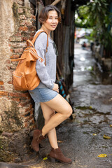  Thai women wear comfortable dress posing in an old location in Bangkok, Thailand