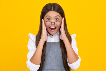 Excited face, cheerful emotions of teenager girl. Portrait of teenager child girl in glasses. Kid...