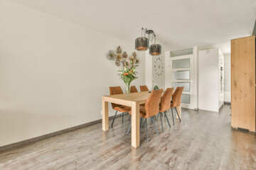 Contemporary minimalist style interior design of light studio apartment with wooden table and...