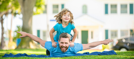 Banner of father and son in summer park outdoor. fathers day. happy father and son having fun in yard. family value. childhood