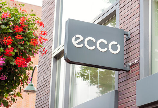 Ecco shoe manufacturer and retailer sign and logo hanging on shop wall outdoors on 25 August, 2018 in Delft, Netherlands