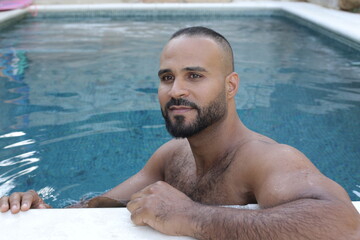 Cute Middle Eastern man swimming pool 