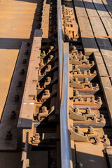 Connecting rails on the viaduct along the tracks. Day.