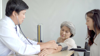 Fototapeta premium Elder woman talking and having a consulting to doctor about disease. Wellness and health care concept.