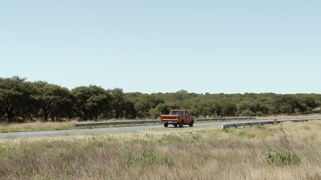 Old Red Pickup Truck on a Rural Road in Argentina. 4K Resolution.