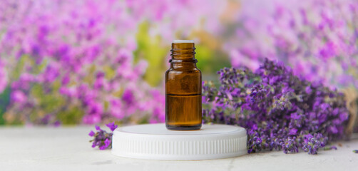 Obraz na płótnie Canvas Essential oil with lavender extract. Selective focus.