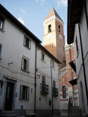 Fototapeta na wymiar Rivisondoli - Abruzzo - The bell tower of the church of San Nicola rises above the roofs of the houses as if it wanted to protect the small tourist village