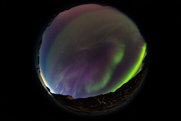 Spectacular aurora borealis or northern lights, circular fish-eye