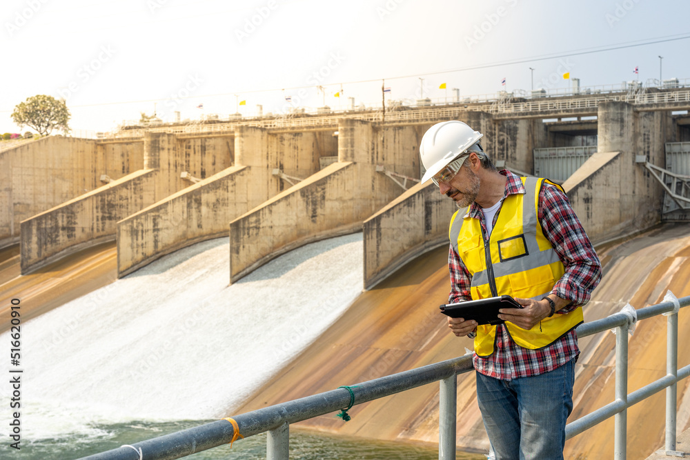 Wall mural a dam engineering doing his daily routine inspection work.