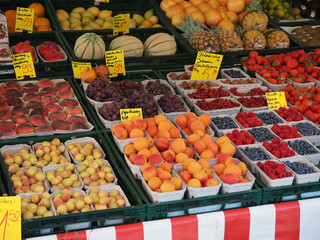 various fruits including berries peaches apricots melons