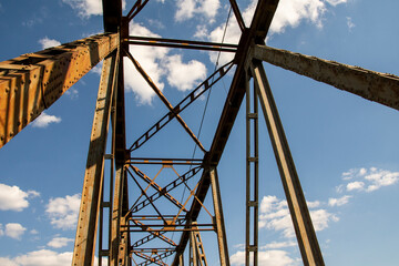 Railway viaduct against the sky and clouds in an unusual wide angle perspective. Day.
