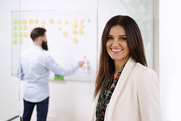 Cheerful confident business woman or manager in modern office. Business concept.
