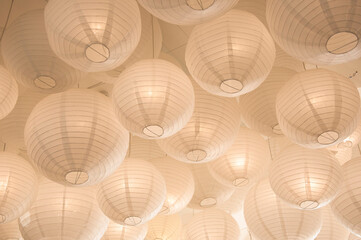 Decorative paper lampions chinese lantern decoration hanging from ceiling - obrazy, fototapety, plakaty