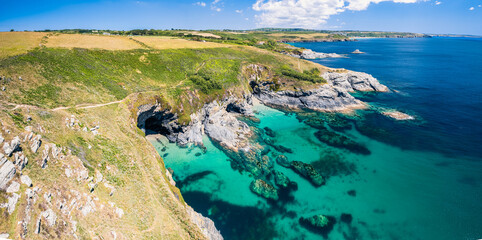 Top Down over Piskies Cove and HMS Warspite Cliffs from a drone, Penzance, Cornwall, England