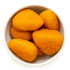 Fried breaded brie nuggets in a white ceramic bowl on white from above.
